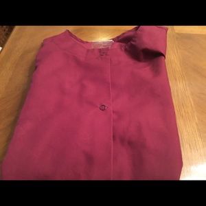 Maroon colored scrub Jacket.